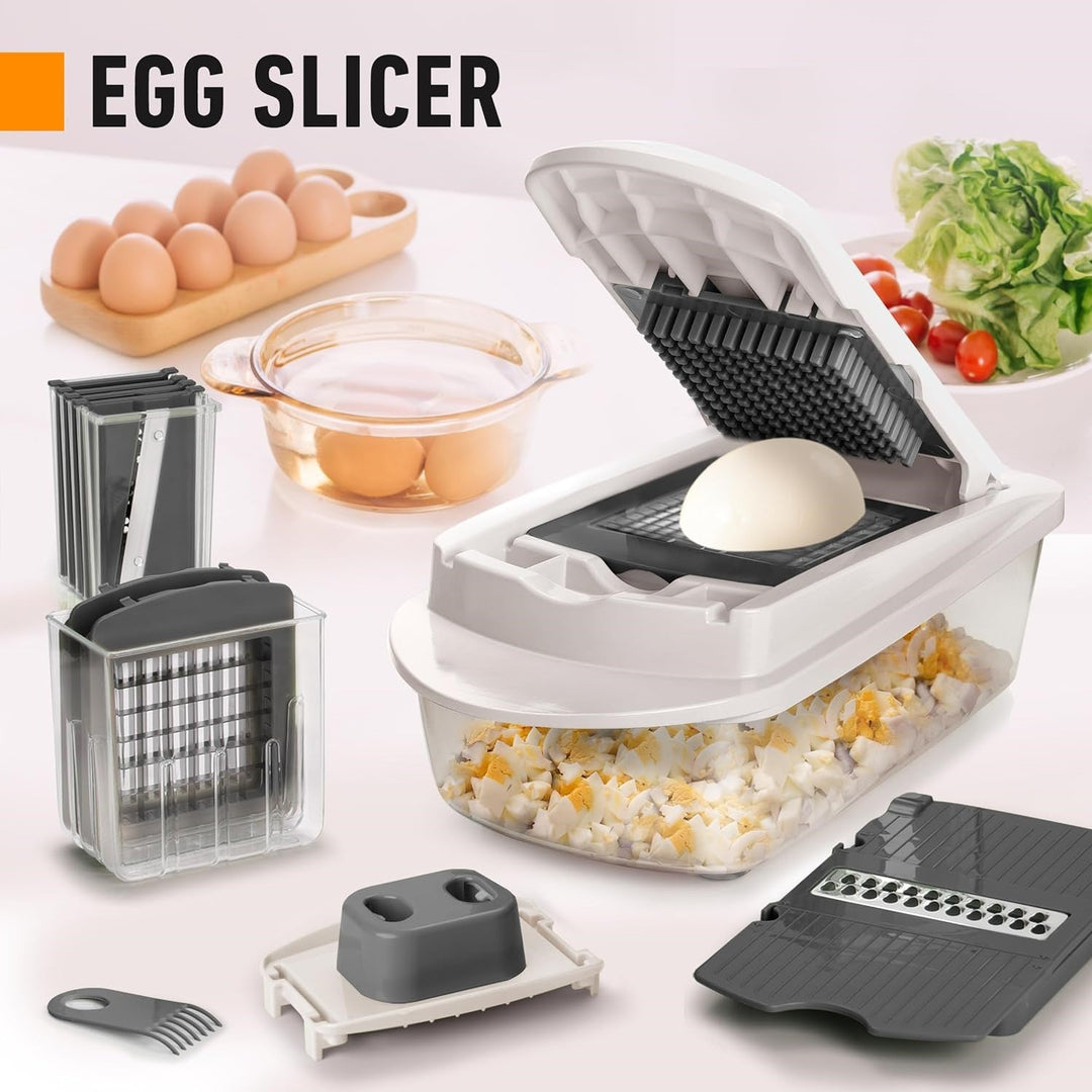 All components of the 10-in-1 vegetable slicer & chopper, including 8 blades and collection tray.