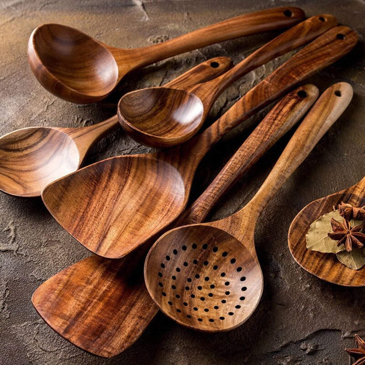 Handcrafted teak wood cooking utensils set; durable spatulas & spoons for everyday kitchen use.