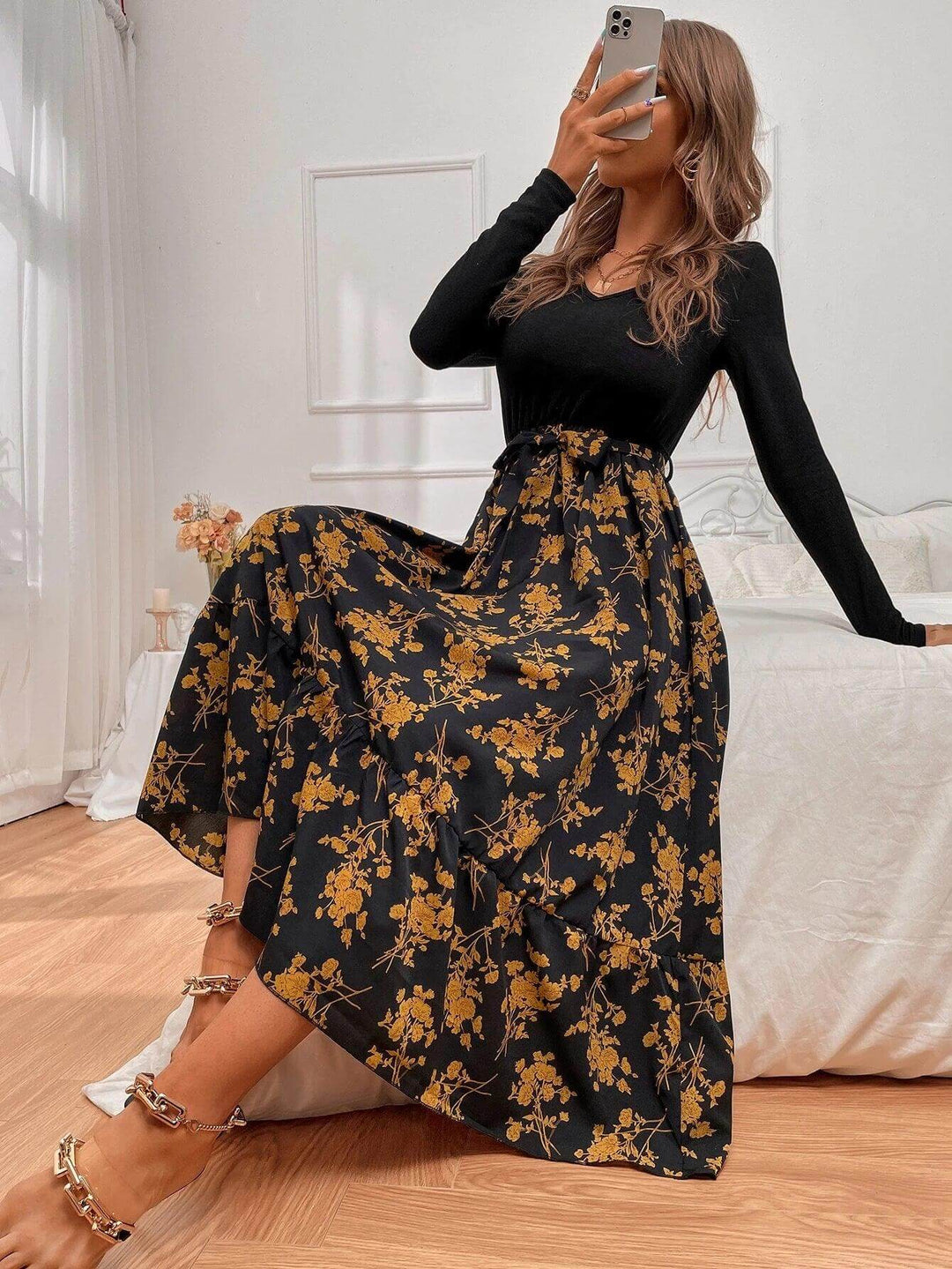 Woman wearing a floral print A-line long sleeve dress