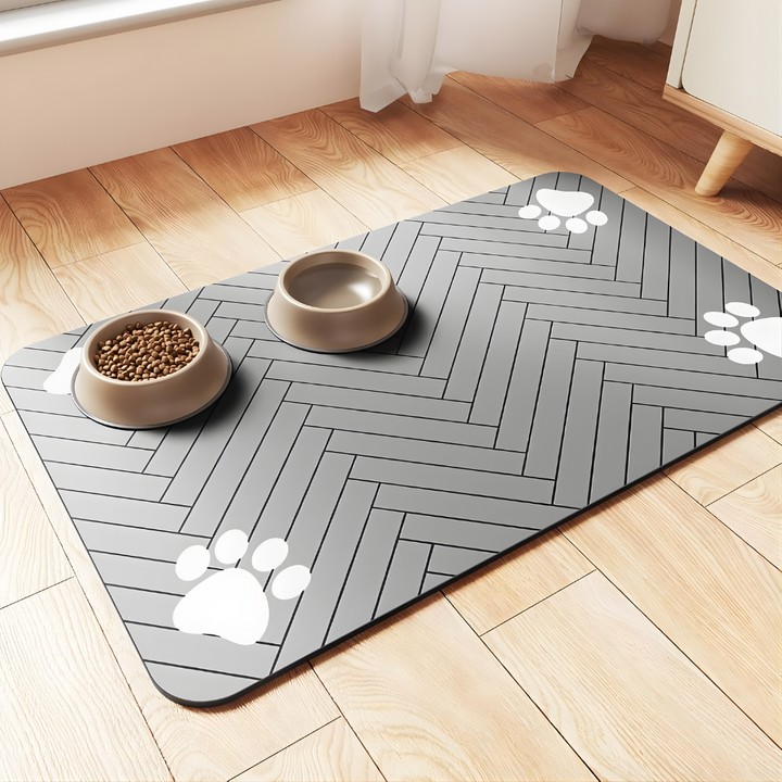 Grey absorbent feeding mat for pets, prevents spills and protects flooring from mess.