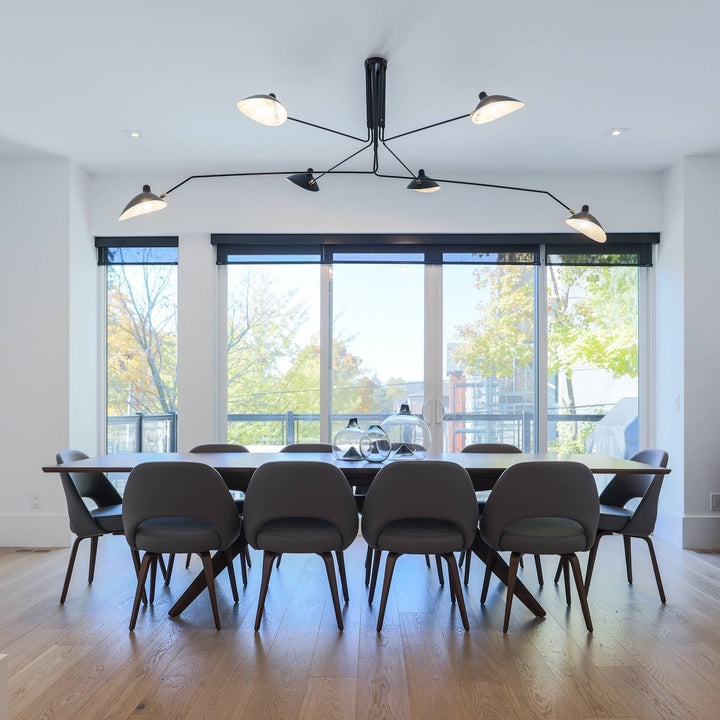 "Adjustable ceiling light with multiple arms, minimalist design, ideal for modern interiors, made of steel and aluminium."