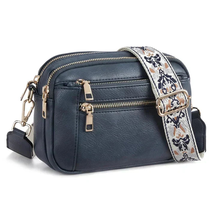 Women's cross-body adjustable bag strap. Stylish replacement shoulder strap for versatile wear.