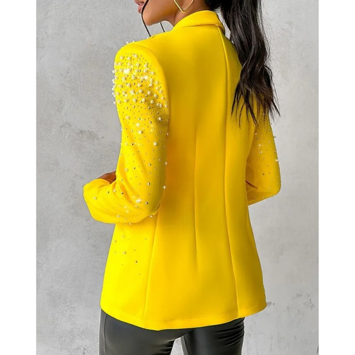 Amara women's slim fit blazer, a fashionable jacket with elegant pearl details for a sophisticated look.