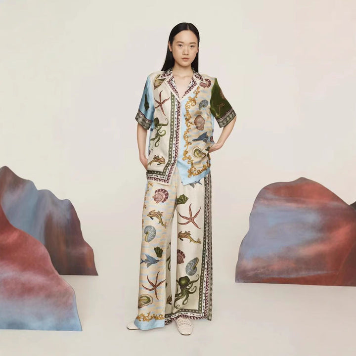 Casual apricot linen blend two-piece set with marine print shirt & wide-leg pants, great for summer resort fashion.