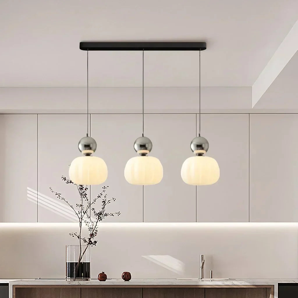 "Art Deco Cream Pendant Light with Bauhaus design, features high-quality metal frame and warm glow for elegant home lighting.