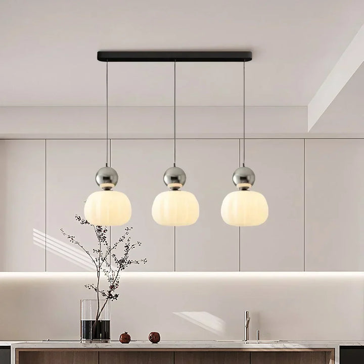 "Art Deco Cream Pendant Light with Bauhaus design, features high-quality metal frame and warm glow for elegant home lighting.