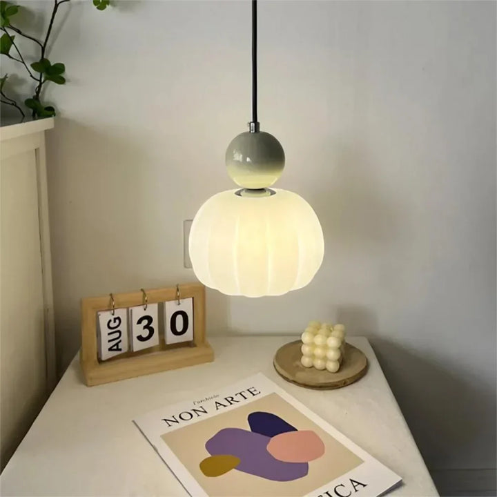 Art Deco Cream Pendant Light with Bauhaus design, featuring a high-quality metal frame and warm glow for elegant home lighting.