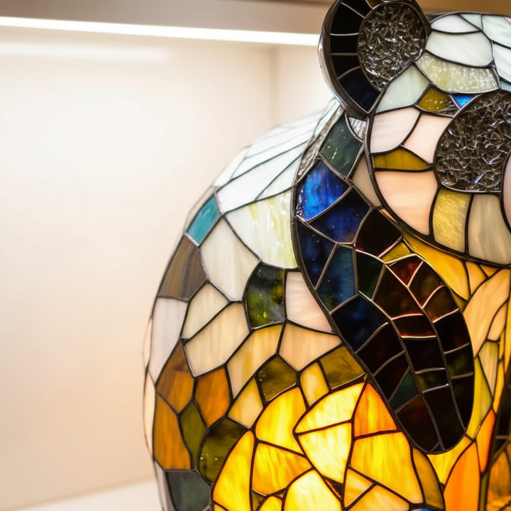 Unique animal table lamp, artistic stained glass design providing warm ambient light for bedrooms.