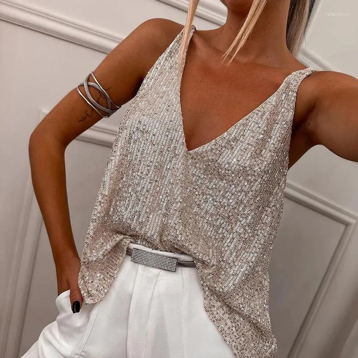 Glamorous women's sequin spaghetti strap top in beige, ideal for special occasions and chic summer style.