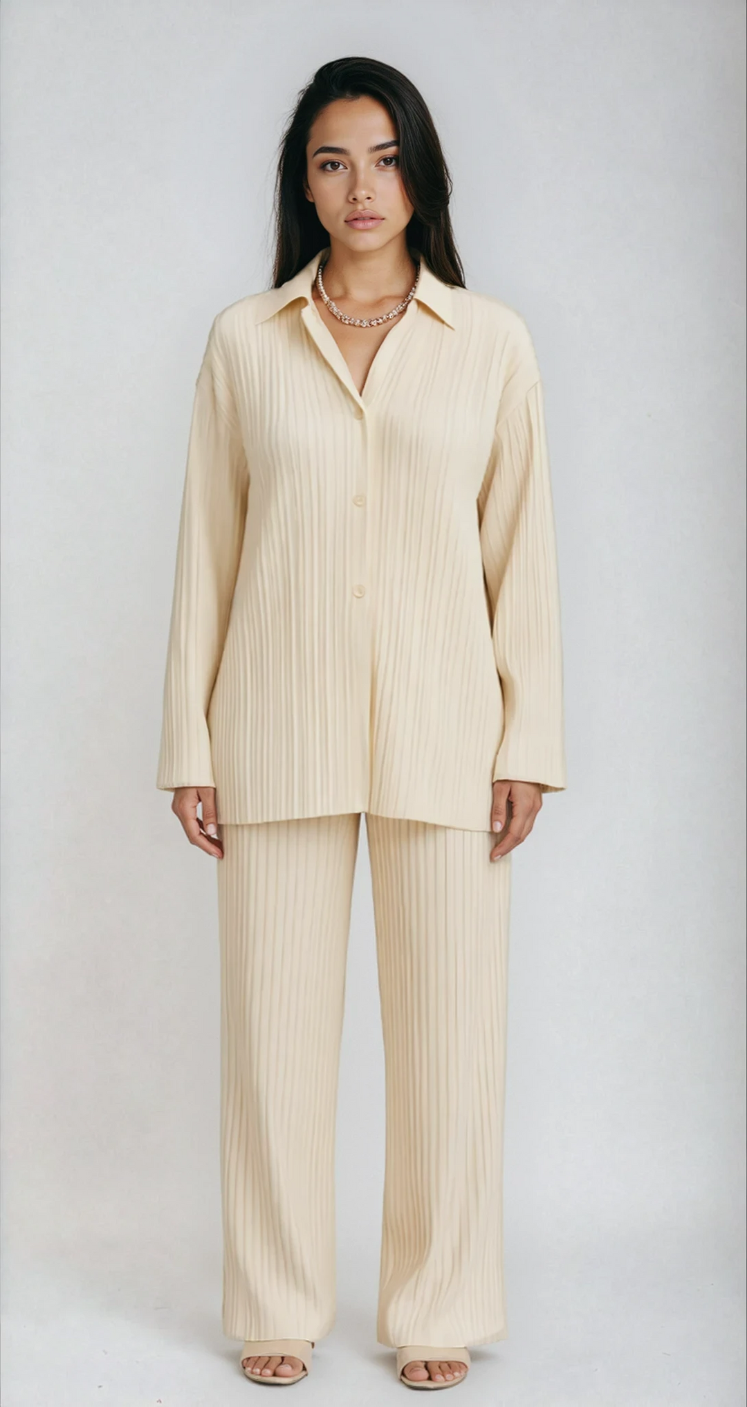 Beige women's oversized pleated lounge set for ultimate comfort. Two-piece luxury loungewear for casual elegance.