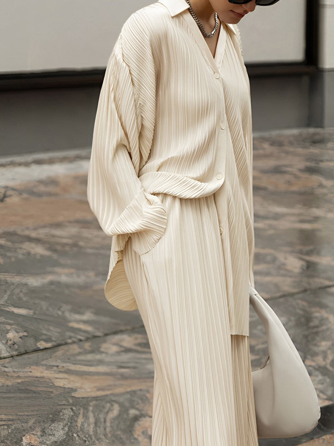 Soft beige pleated oversized lounge set for women. Enjoy effortless comfort and stylish relaxation in this two-piece outfit.