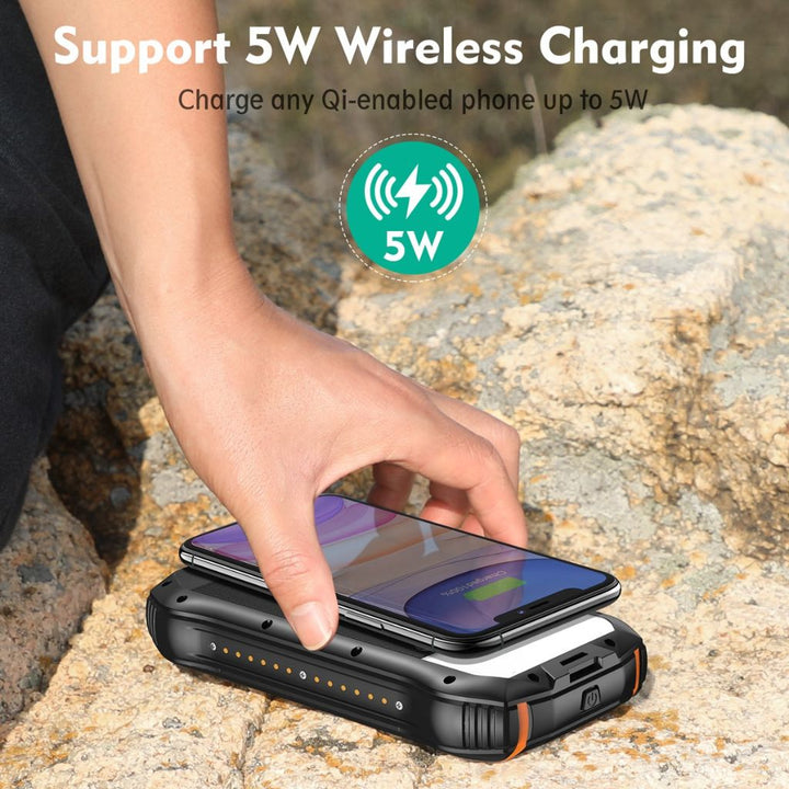 "Black and orange portable solar power bank for outdoor use, showcasing sleek design and multiple charging ports."