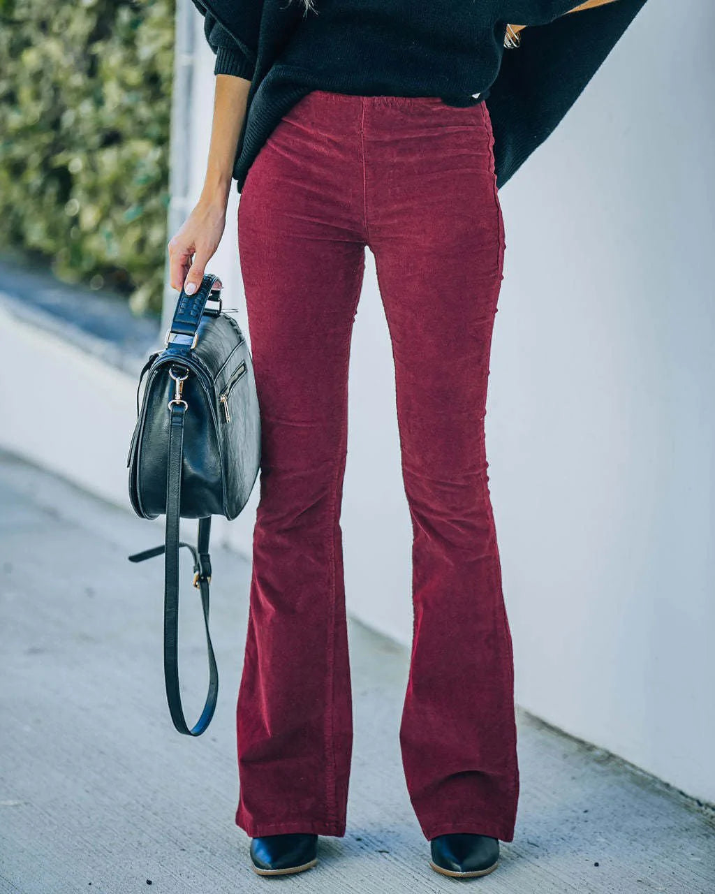 Dark blue flattering high waist flared trousers for women, versatile for everyday & casual looks.