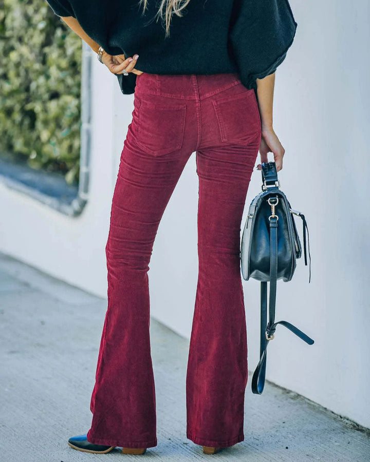 Dark green high waist flared pants, stylish women's trousers for a chic everyday look.