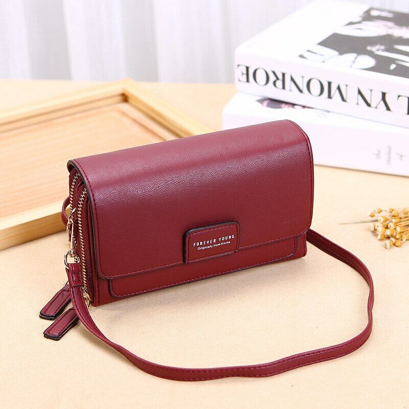 Modern brown leather wallet crossbody, sleek design for ladies' essentials, secure compartments.