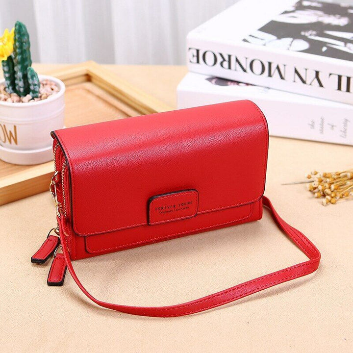 Practical black PU leather women's crossbody bag, smart organizer with multiple compartments.