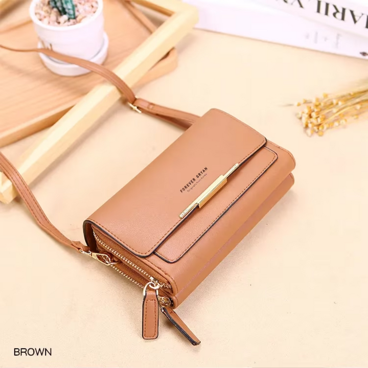 Stylish black leather women's crossbody organizer, with card slots and an adjustable strap.