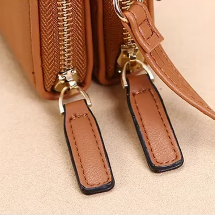 Red leather fashion accessory for women, a compact crossbody wallet purse.