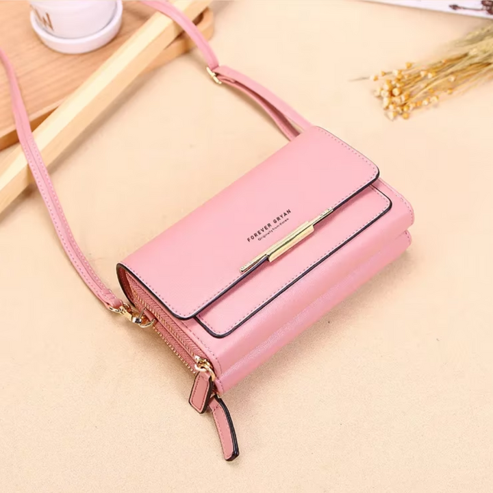 Elegant tan leather women's organizer crossbody, perfect for travel and city adventures.