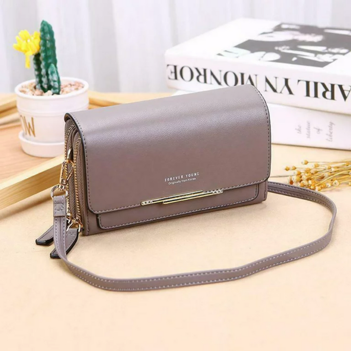 Chic red leather crossbody bag, a compact yet practical fashion statement for women.