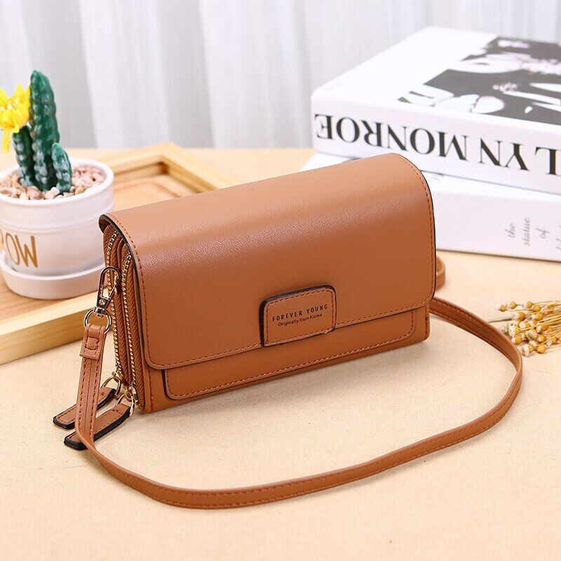 Genuine leather black crossbody, ideal women's bag with organizer features & adjustable strap.