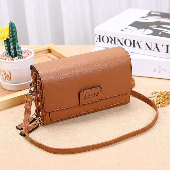 Genuine leather black crossbody, ideal women's bag with organizer features & adjustable strap.
