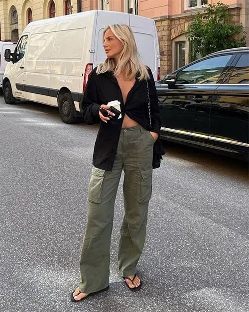 "Black wide-leg women's cargo pants, relaxed fit with functional pockets, versatile style for casual or polished looks."