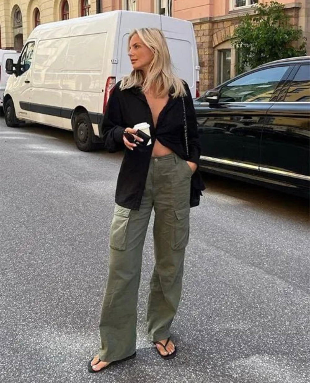"Black wide-leg women's cargo pants, relaxed fit with functional pockets, versatile style for casual or polished looks."