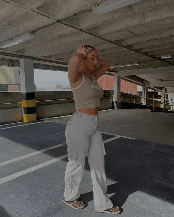 "Black wide-leg women's cargo pants, relaxed fit with functional pockets, versatile style for casual or polished looks."
