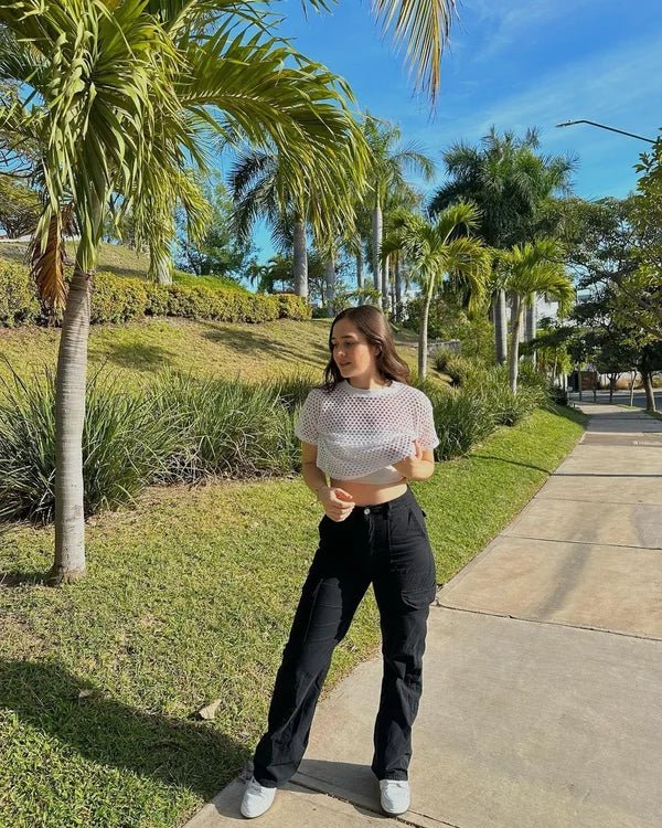 "Black wide-leg women's cargo pants, relaxed fit with functional pockets, versatile style for casual or polished looks."