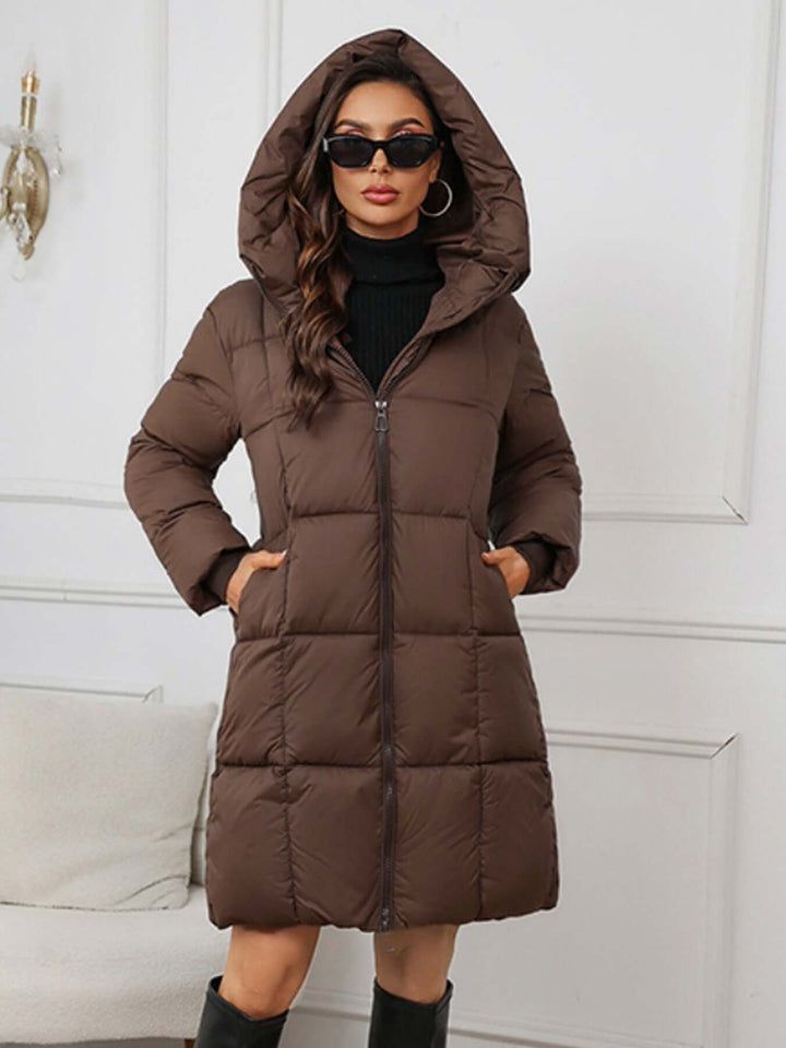 Black Women's long hooded winter puffer coat for ultimate warmth & style.