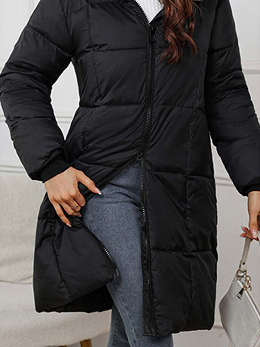 Women's long insulated puffer coat with hood, a must-have winter jacket for women.