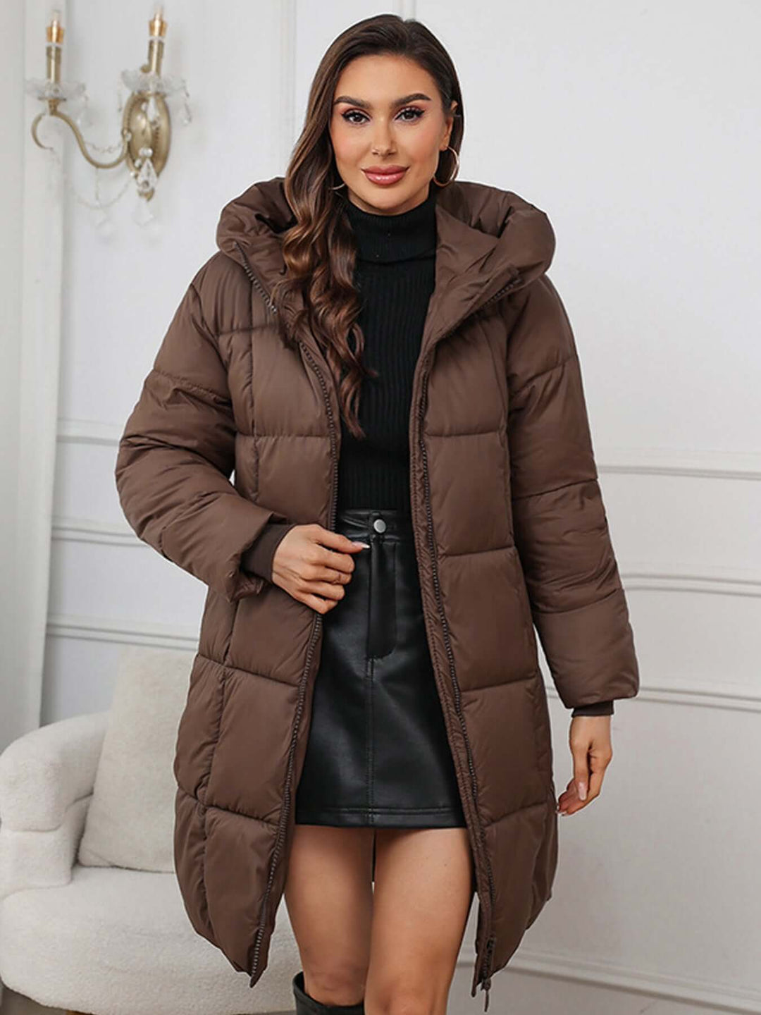 Brown Women's insulated long hooded puffer coat, ideal for cold weather.