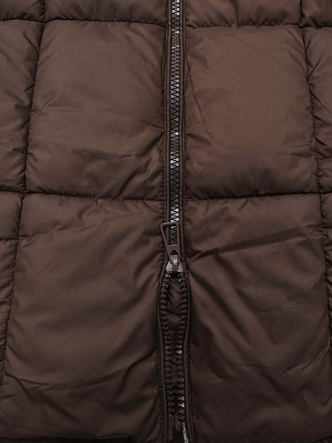Brown women's long puffer coat, insulated and hooded for maximum winter protection.