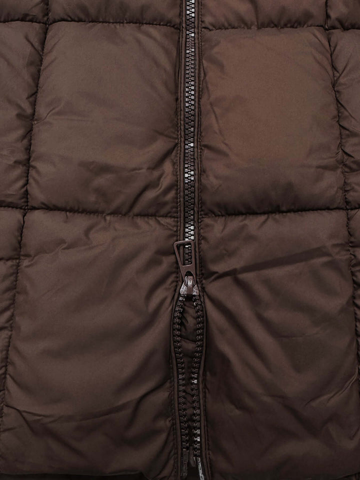 Brown women's long puffer coat, insulated and hooded for maximum winter protection.