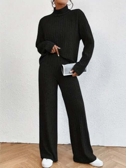 Women's black ribbed turtleneck and wide-leg pants set. Casual chic two-piece outfit for cozy, versatile wear.