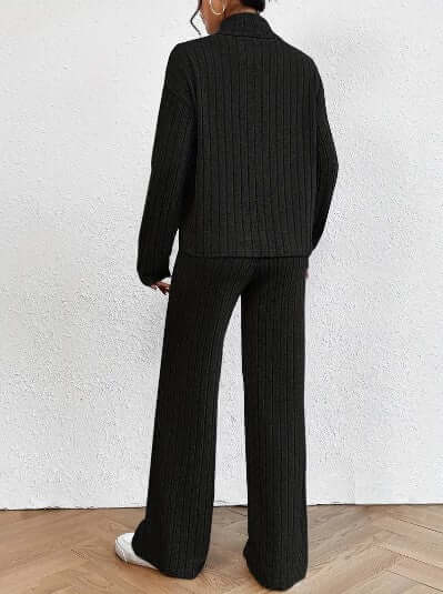Stylish women's black ribbed turtleneck & wide-leg pants set. Chic two-piece outfit, perfect for lounge or casual wear.