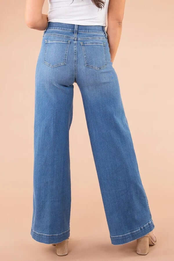 Effortlessly stylish women's high-waist wide-leg jeans in classic blue denim, ideal for casual wear.