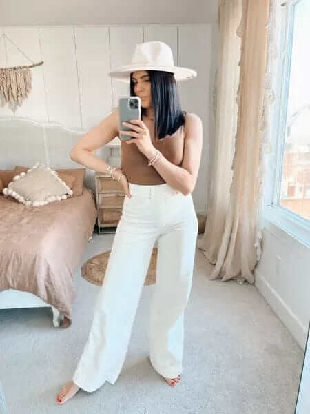 Stylish women's high-rise wide-leg blue jeans, offering a flattering silhouette & all-day comfort.