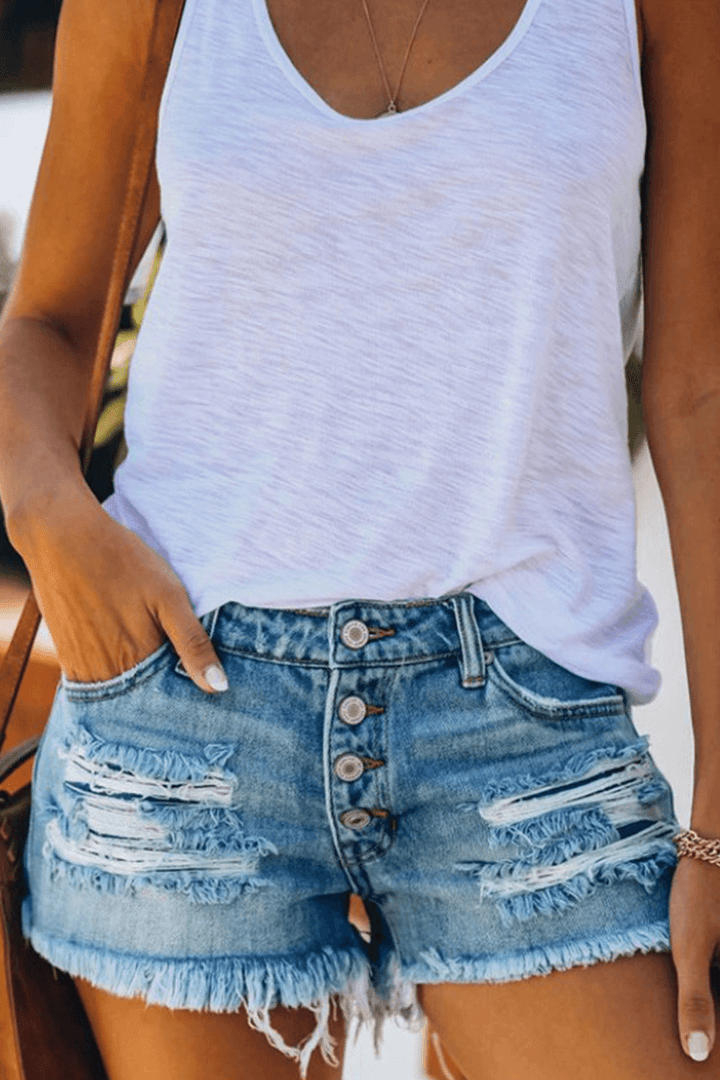 Trendy women's blue denim shorts, high-waisted and distressed with a stylish fringe hem. Ideal for summer casual wear.