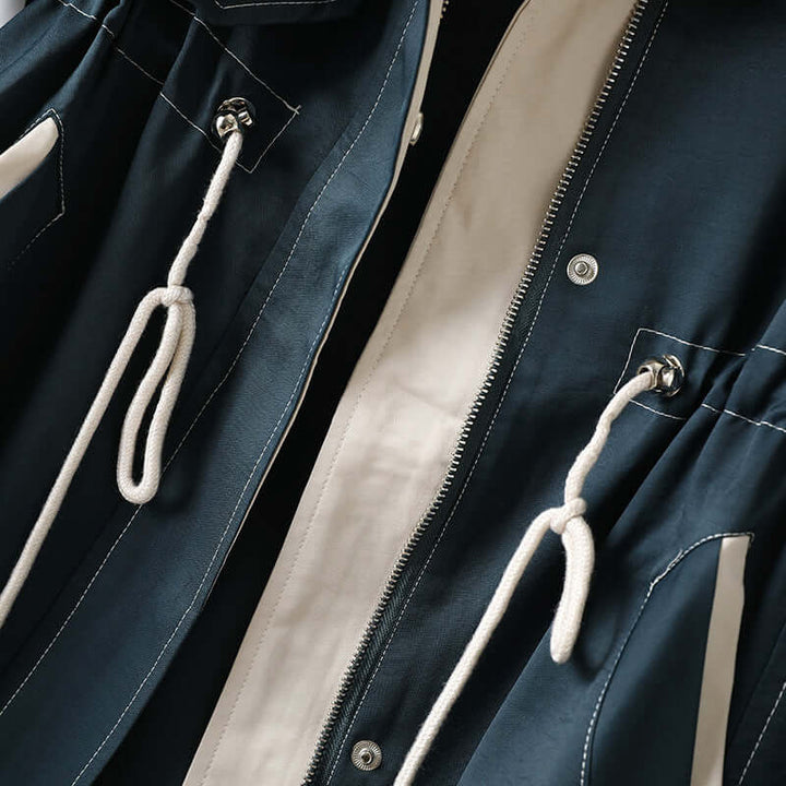 Stylish blue women's hooded windbreaker, lightweight & rain-resistant, perfect for spring/fall outdoor & activewear.