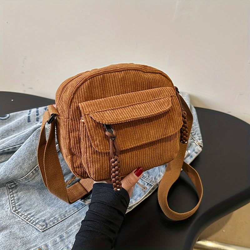 Brown women's small crossbody bag with front zip pocket, perfect for hands-free daily essentials.
