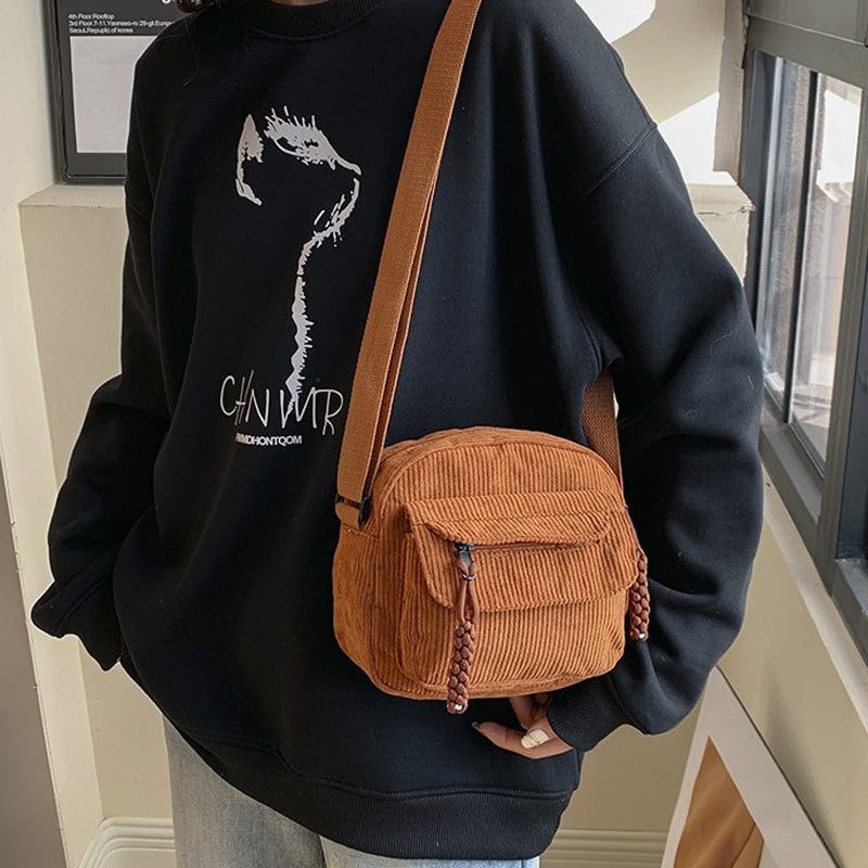 Versatile brown small women's crossbody bag, perfect for travel & daily use, front zip pocket.