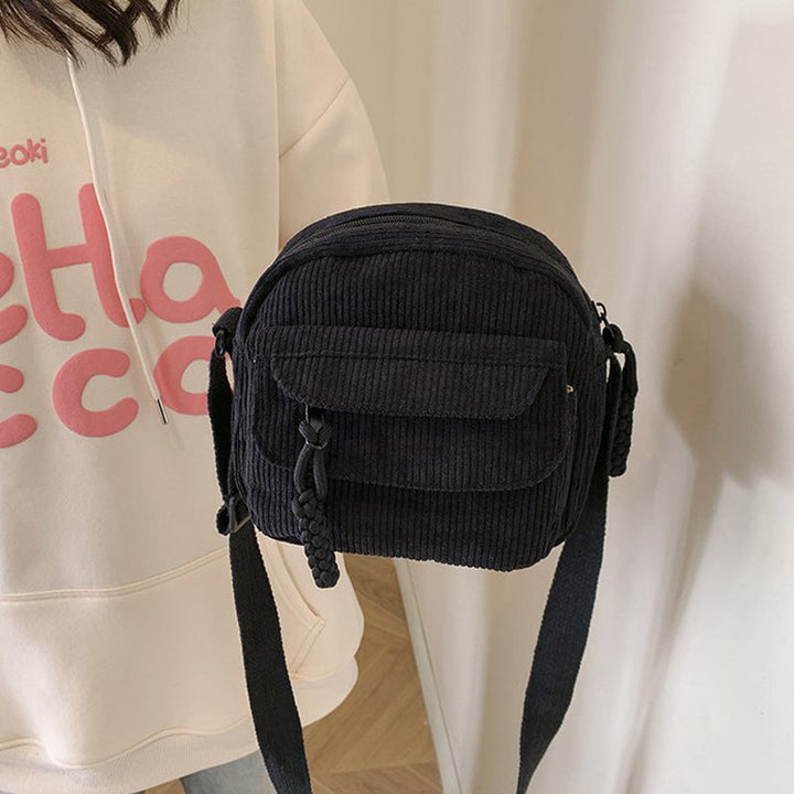 Women's black vintage style small crossbody bag, perfect for essentials & hands-free use.