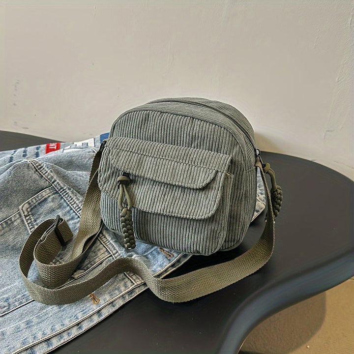 Green women's small crossbody bag with front zip pocket, perfect for hands-free daily essentials.