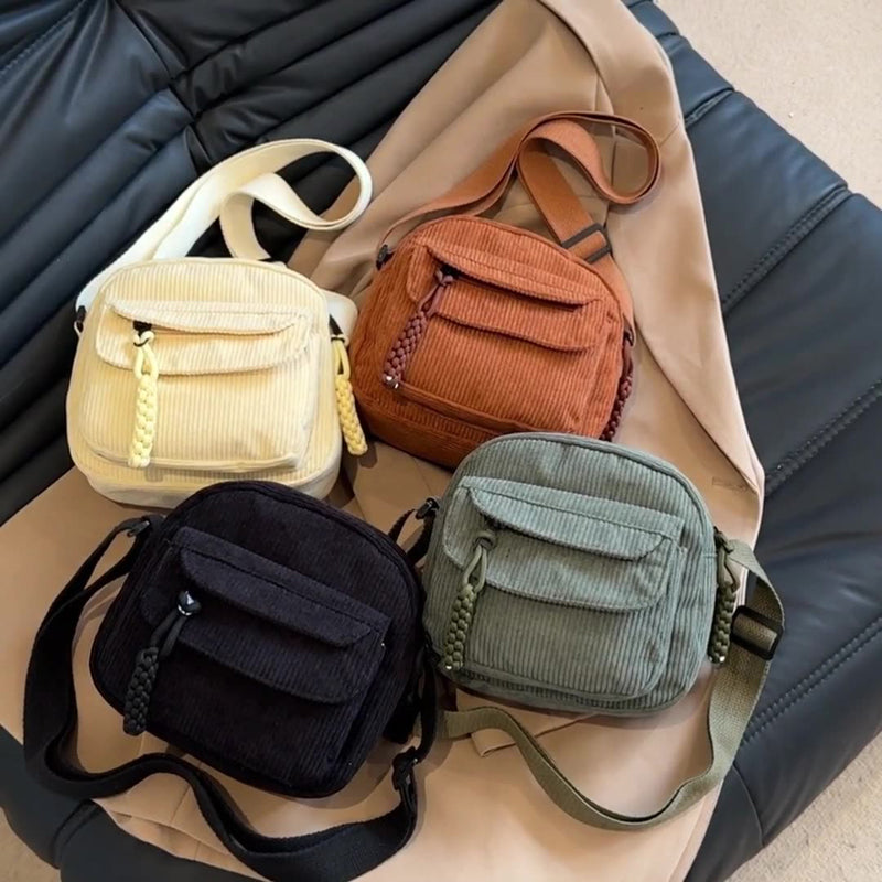Forest green small crossbody bag for women, features a practical front zip pocket & adjustable strap.