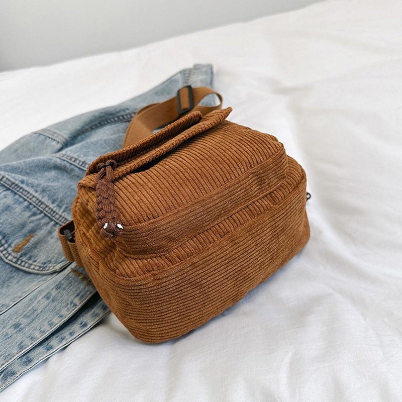 Chic brown small crossbody bag for women, ideal for essentials with its front zip pocket.
