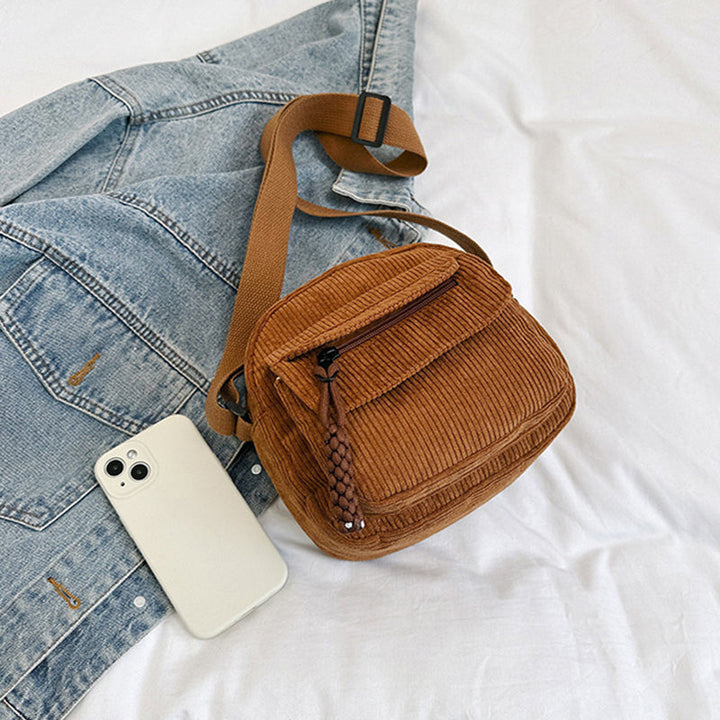 Women's brown vintage style small crossbody bag, perfect for essentials & hands-free use.