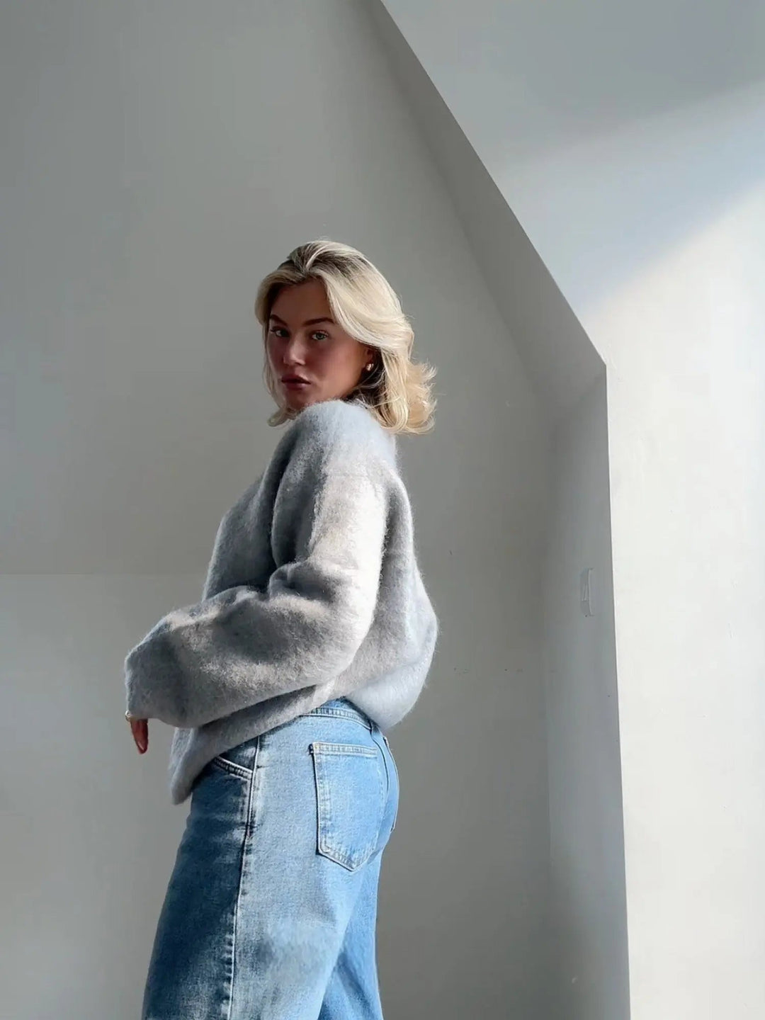 Chic and versatile women's elegant pullover, a relaxed fit grey sweater for cozy style.