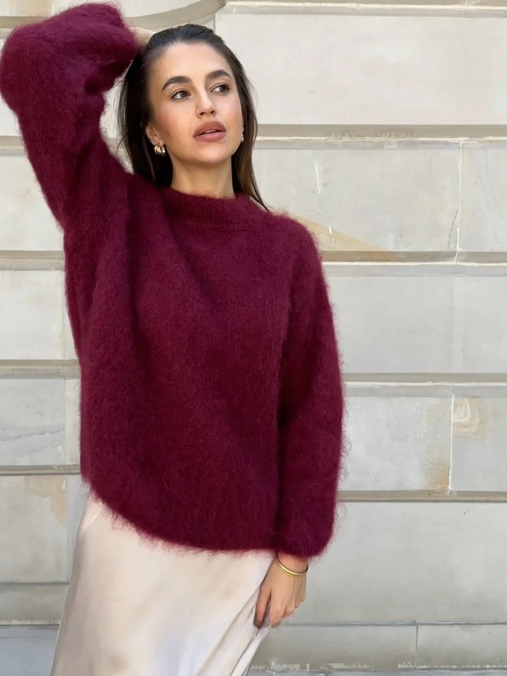 Sophisticated women's relaxed fit sweater, a comfortable and chic cream pullover for stylish wear.